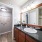 bright bathroom with access to walk-in closet