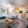 fireside seating in living room with ceiling fan and light fixture