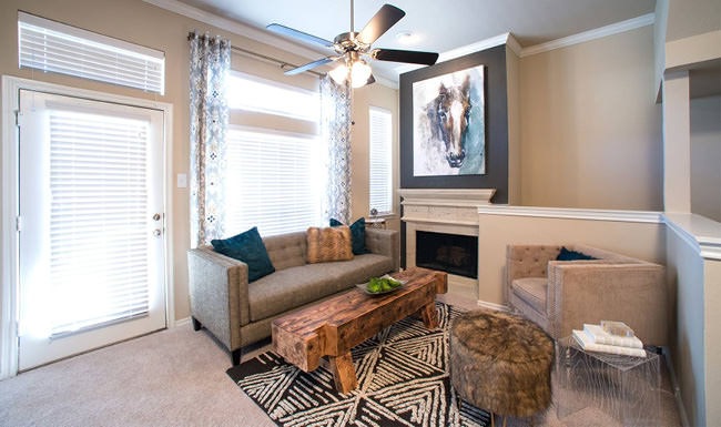 Stylish Interiors bright living room with fireplace and ceiling fan