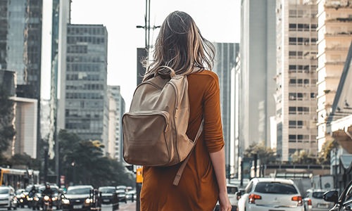 woman walks through the city